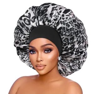Detailed view of large leopard print satin bonnet with black wide elastic headband