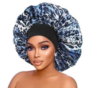 Detail view of the blue leopard print satin bonnet featuring a wide elastic black band