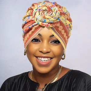 Ethnic African style floral knot turban with bohemian geometric prints in yellow and red