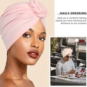Pale pink knotted turban for women with stylish twisted hand-woven decorative detail