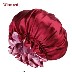 Double-layer satin sleep cap in wine red with a soft pink lining and elastic band