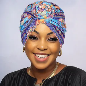 Close-up of vibrant floral turban with a stylish rose knot detail in ethnic print