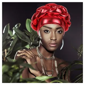 Metallic red braided turban hat for women in African style with oversized twist design
