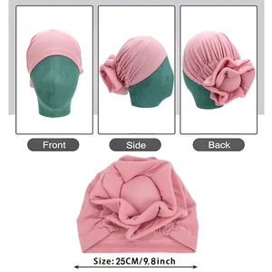 Pink pleated turban for women featuring large floral design and 3D sponge flower detail