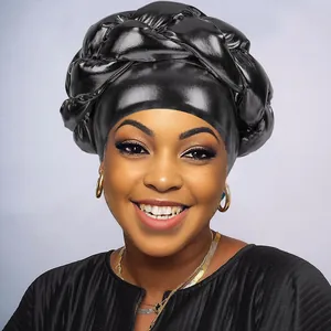 Front view of a shiny black braided turban headwrap with a metallic finish for women