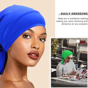 Turban élastique avec nœuds papillon disponible en bleu royal et vert vif