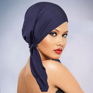 Detail of navy blue turban showing side tie-up design and breathable silky fabric texture