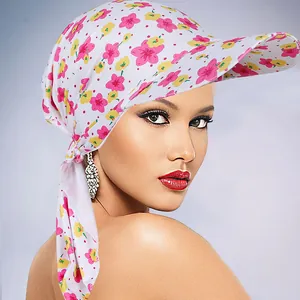 Close-up of floral print sun hat with visor and long scarf tie in pink and yellow patterns