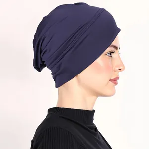 Detail of navy blue stretch inner hijab cap with soft jersey pleats on model