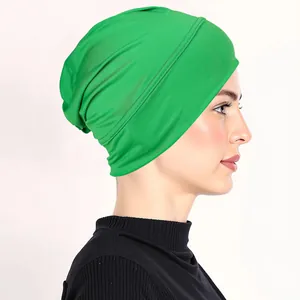 Close-up of vibrant green turban hat fabric texture and fine stitching detail