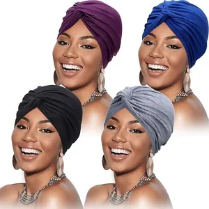 Detail showing cross twist design of women turbans in purple, blue, black and grey