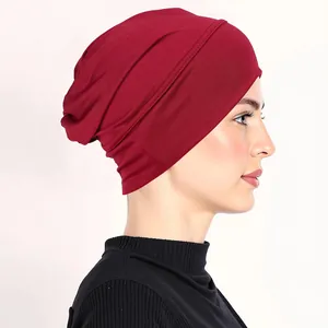 Detail of wine red elastic turban hat with pleated texture for Muslim women headwear