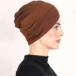 Detailed side view of dark brown elastic hijabs underscarf with wide-edge stitching