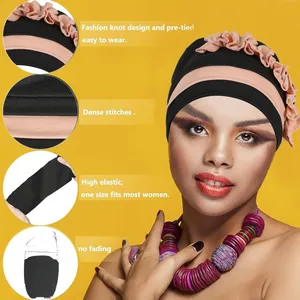 Turbante bicolore nero e rosa per donna con design a pieghe ed alta elasticità