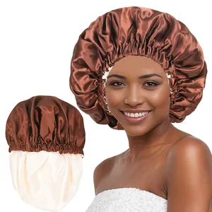 Detail view of double-layered satin hair bonnet showing brown and cream dual-color design