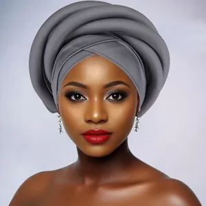 Detail of grey braided African twisted turban featuring multi-layer spiral design and texture