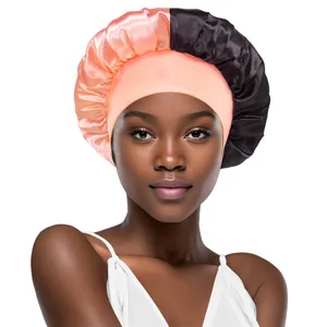 Detail of pink and black satin bonnet with elastic wide band for hair care