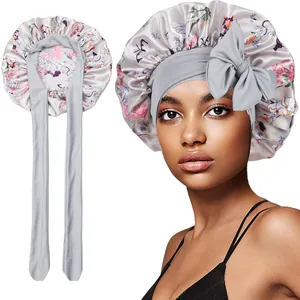 Detail of floral satin bonnet showing long adjustable straps and elegant hair protection fit