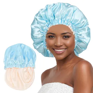 Detail of double-layered sky blue and champagne satin bonnet with elastic hair care band