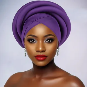 Close-up of a purple braided African turban featuring multi-layered spiral sponge wrap texture