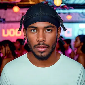 Silky black durag for men with long straps featuring a high-gloss satin texture for style