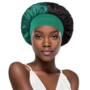 Close-up of dual-color satin sleep bonnet with wide elastic band in green and black