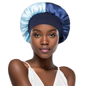 Close-up of dual-tone satin sleep bonnet with wide elastic band on a model