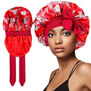 Detail of red floral satin bonnet featuring adjustable wide tie-band and large side bow