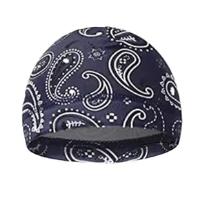 Close-up of elastic synthetic fabric with white paisley patterns on a navy skull cap