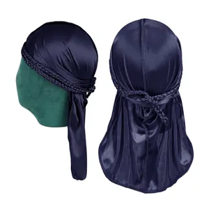 Navy blue silky durag with triple braided straps and long tail on a model head