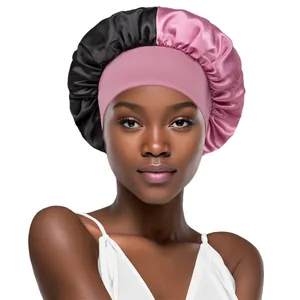 Detail of satin hair bonnet with pink elastic wide band and black silky pleated fabric