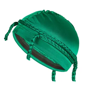 Detail of emerald green satin durag featuring a thick braided trim and glossy finish