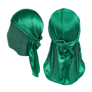 Detailed side view of emerald green silky durag with braided band and long tail