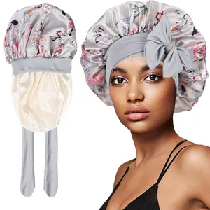Detail view of floral satin sleep bonnet with high-elastic wide strap and smooth lining