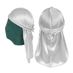 Detail of silver silky durag featuring a braided headband and long tail on head model