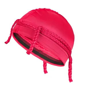 Macro detail of red satin cap with braided accents and black elastic band edge