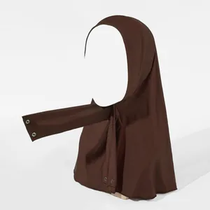 Detail of dark brown elastic hijab with silver metal snap buttons for secure fastening