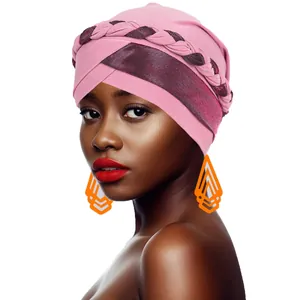 Detail of pink fashion turban with braided trim and metallic crossover forehead design