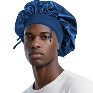 Detail of navy blue satin sleep bonnet featuring wide elastic band and woven side ties