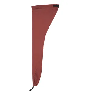 Detail view of brick red mesh wig cap with adjustable buckle and elastic drawstring closure