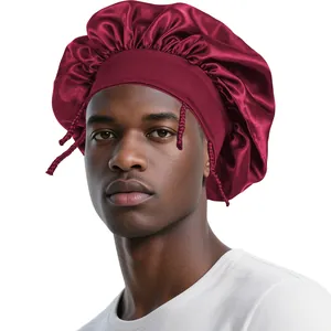 Detail of burgundy satin hair bonnet for men featuring wide elastic band and silky finish