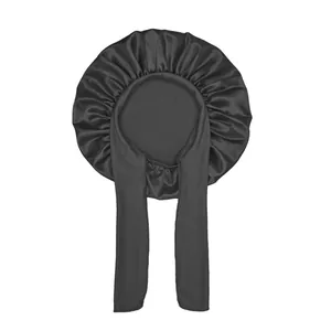 Detail view of smooth black satin bonnet with long straps for hair protection