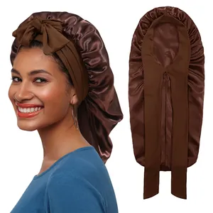 Detail of dark brown satin hair bonnet with adjustable ribbon ties and glossy texture