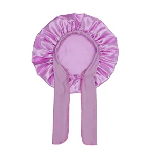 Macro detail of lavender satin sleep cap showing glossy fabric and adjustable tie straps