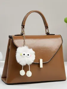 Damen Fashion PU Leder Handtasche Elegante Trapezförmige Henkeltasche Mit Plüschmonsteranhänger Schultertasche Umhängetasche