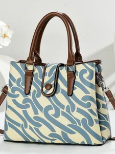 Elegant geometric print satchel bag with brown faux leather trim and detachable shoulder strap