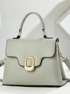Elegante borsa a mano in pelle verde chiaro con motivo litchi e chiusura in metallo dorato