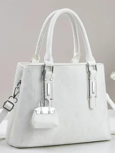 White tote bag with vertical stripes, dual handles, and a mini hanging pouch accessory