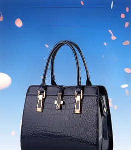 Close-up of deep blue crocodile pattern patent leather with elegant gold metal lock