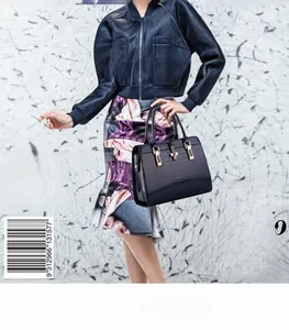 Fashionable navy blue crocodile pattern handbag with elegant gold buckle on model
